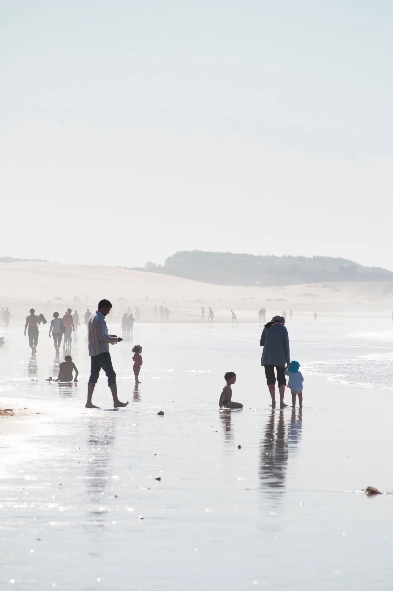 Tourists enjoying a beach holiday on the sandy Atlantic coast